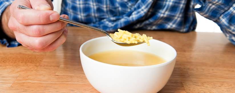 man eating soup