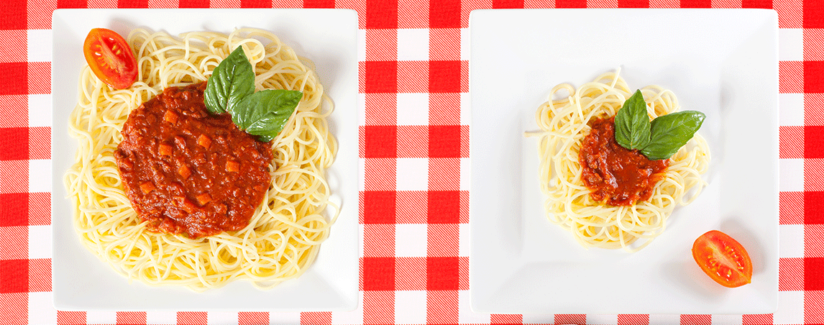 large and small plates of spaghetti
